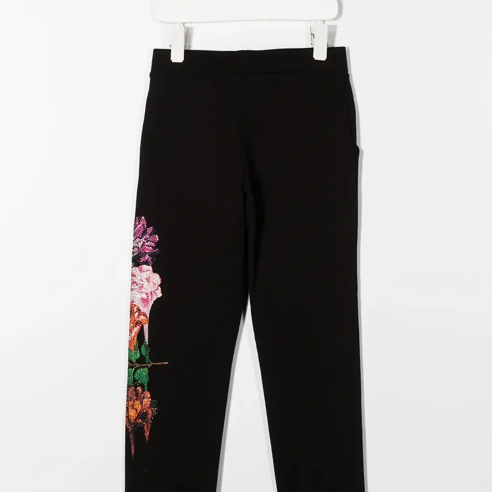 Брюки с цветочным принтом и стразами