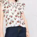 блузка с оборками и цветочным принтом