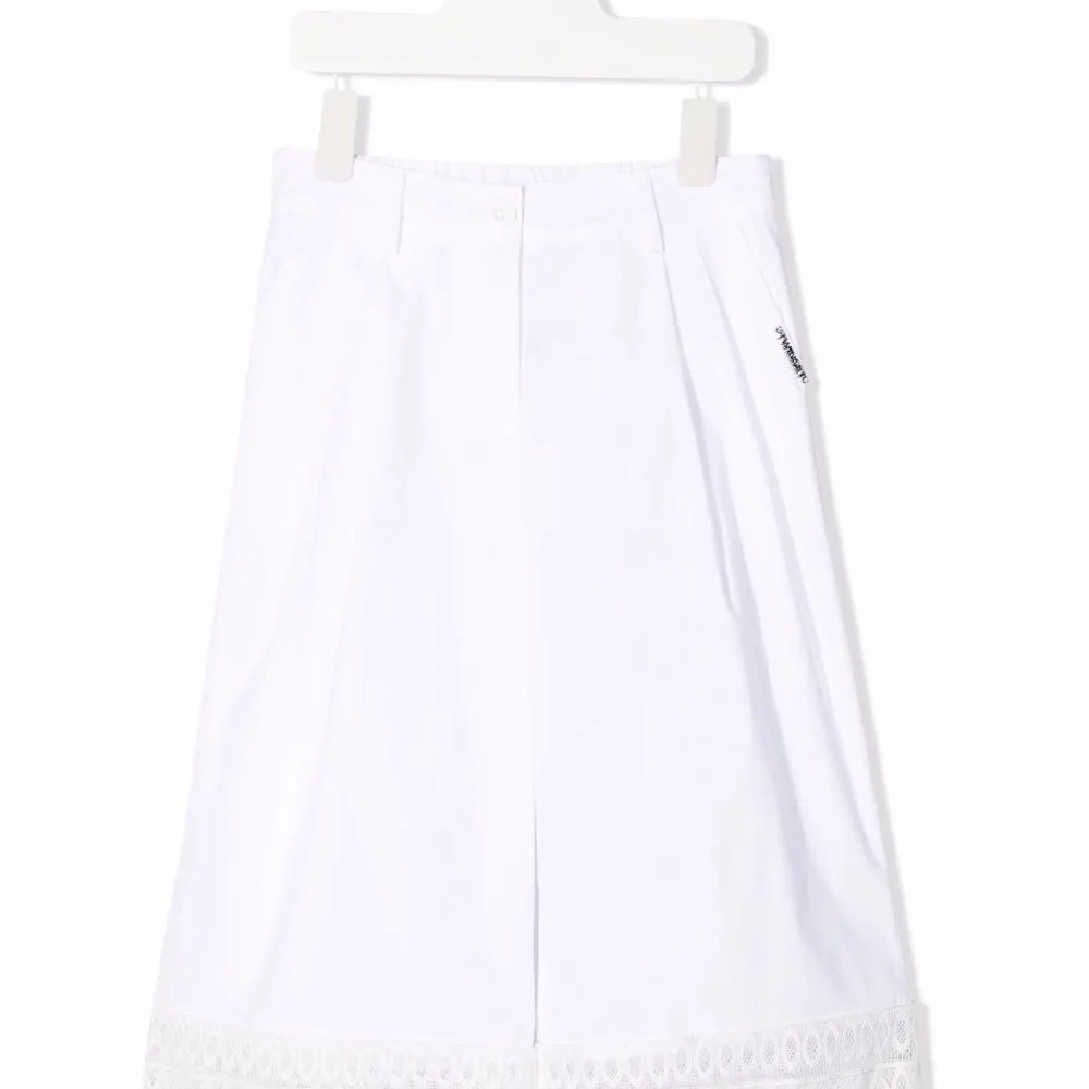 Широкие брюки с бахромой