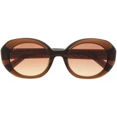 Солнцезащитные очки в овальной оправе с кристаллами