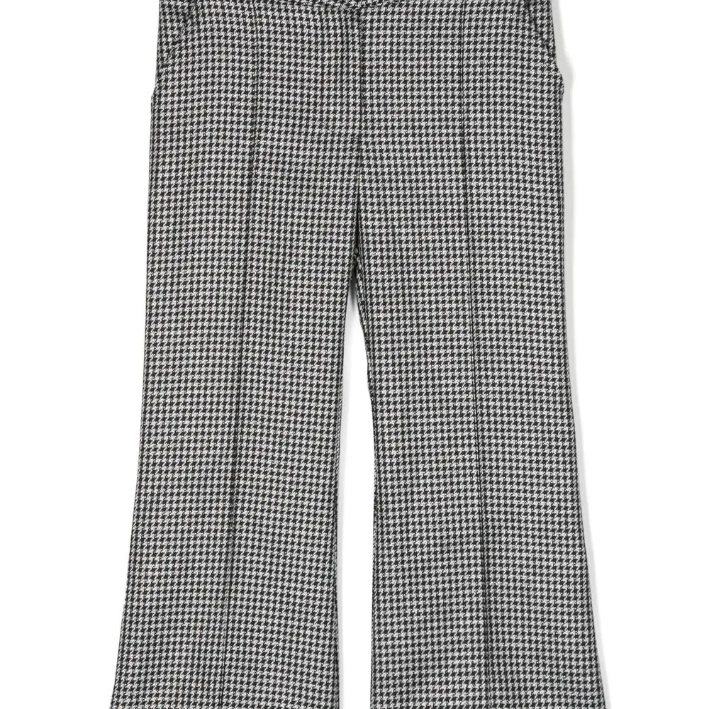 Брюки в ломаную клетку