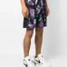 Шорты-бермуды с абстрактным принтом