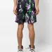 Шорты-бермуды с абстрактным принтом