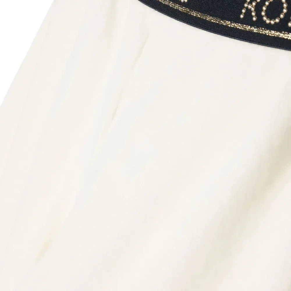 Бархатные брюки с заклепками и логотипом