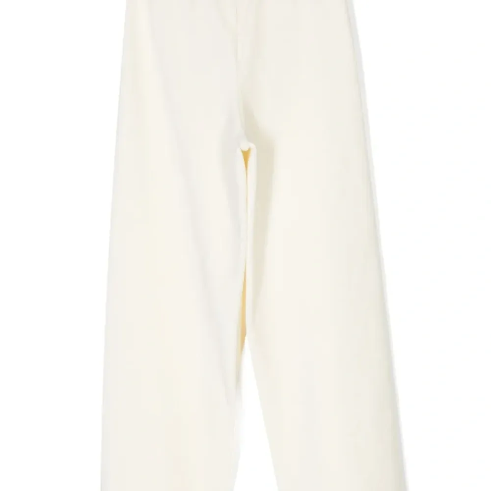 Бархатные брюки с заклепками и логотипом