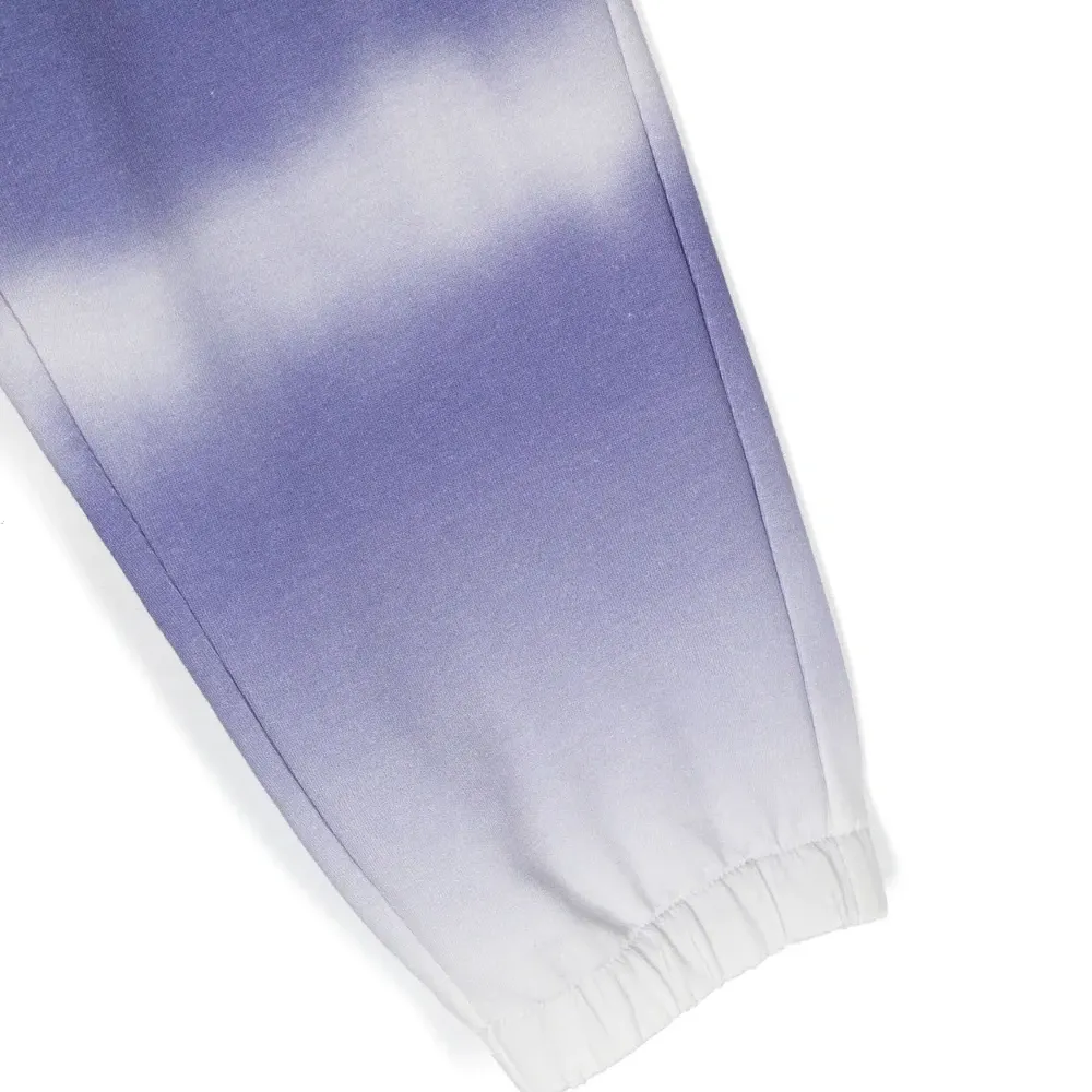 Брюки с эластичными манжетами и принтом тай-дай