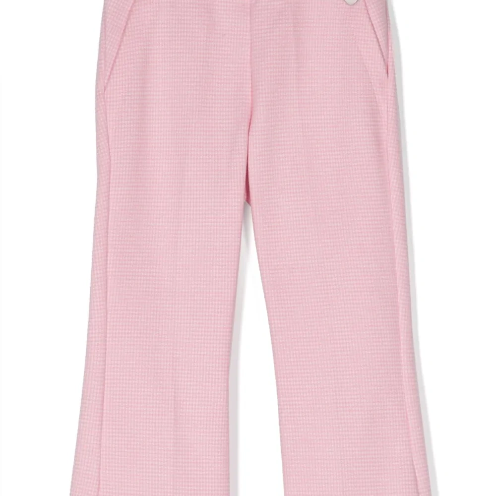 Расклешенные брюки в ломаную клетку