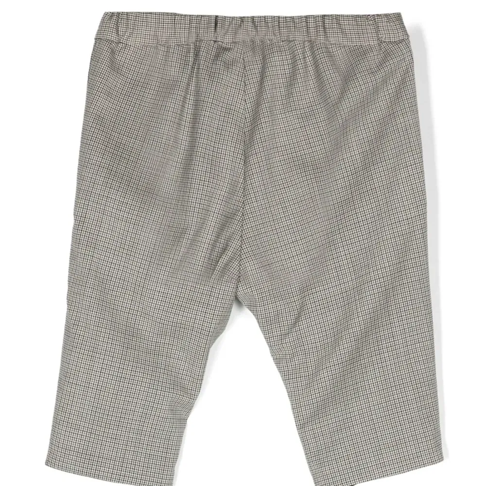 Брюки в ломаную клетку с эластичным поясом