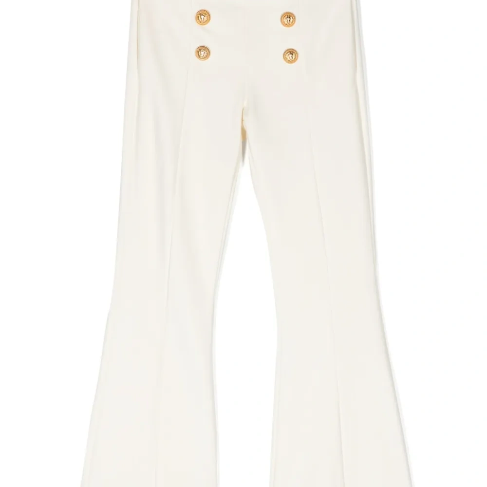 Расклешенные брюки с декоративными пуговицами