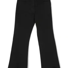 Расклешенные джинсы асимметричного кроя с бахромой Расклешенные джинсы асимметричного кроя с бахромой