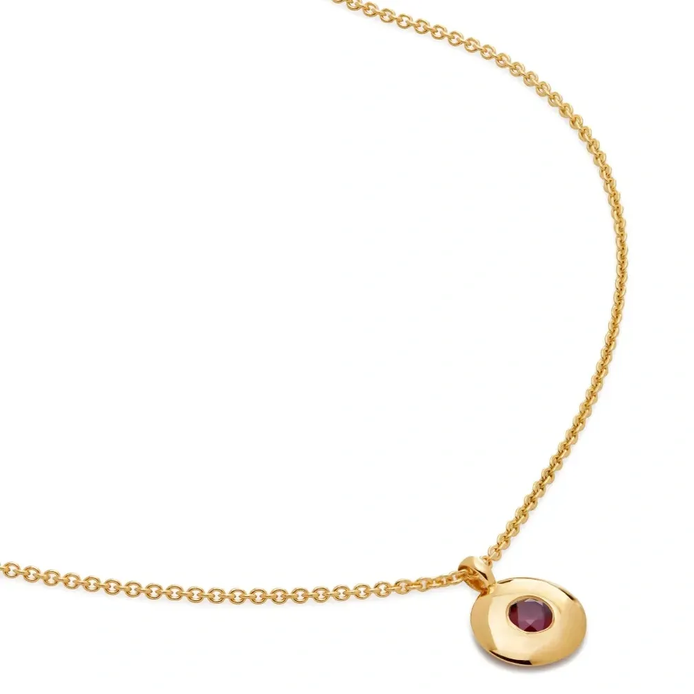 Колье с круглым кулоном, украшенным кристаллами Колье с круглым кулоном, украшенным кристаллами