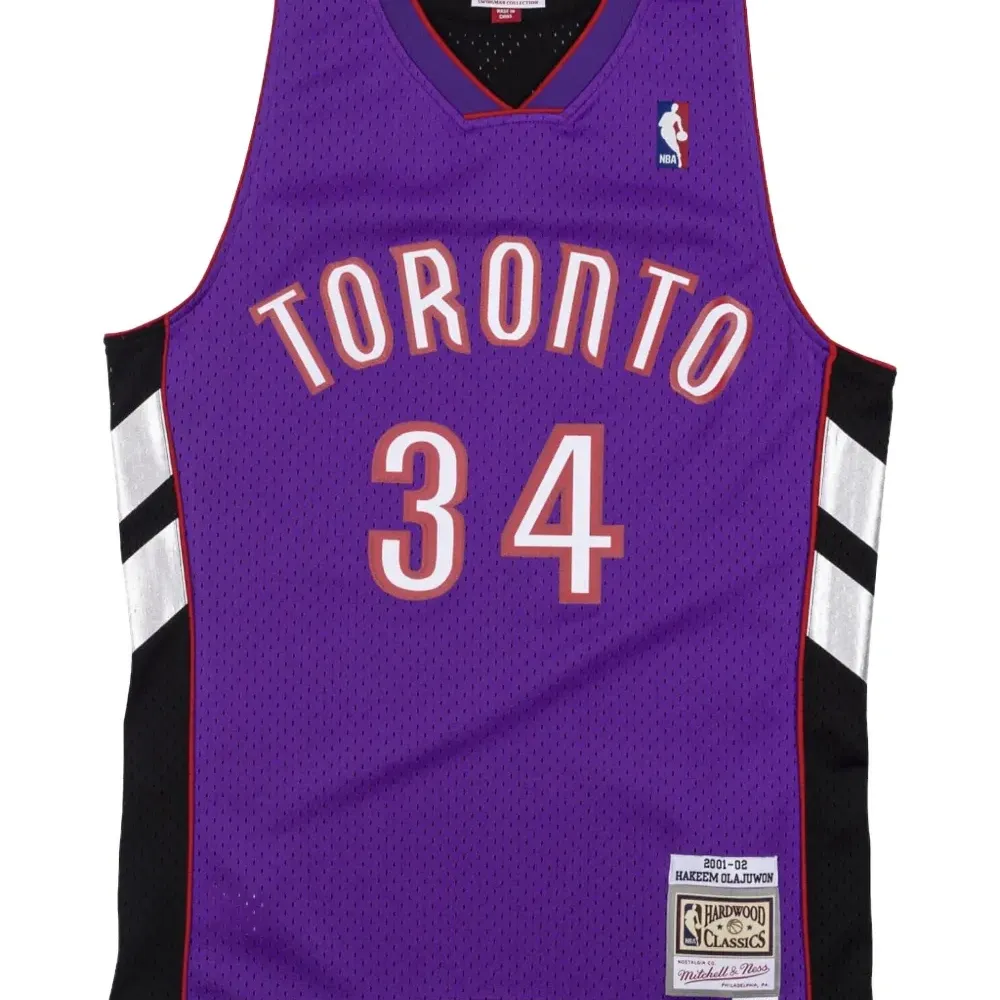 Топ Toronto Raptors 2001-02 Hakeem Olajuwon Swingman из коллаборации с NBA Топ Toronto Raptors 2001-02 Hakeem Olajuwon Swingman из коллаборации с NBA