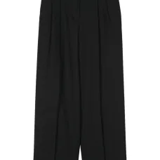 Зауженные брюки со складками