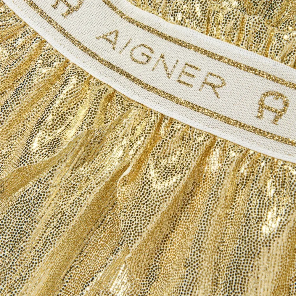 Брюки с баской и эффектом металлик