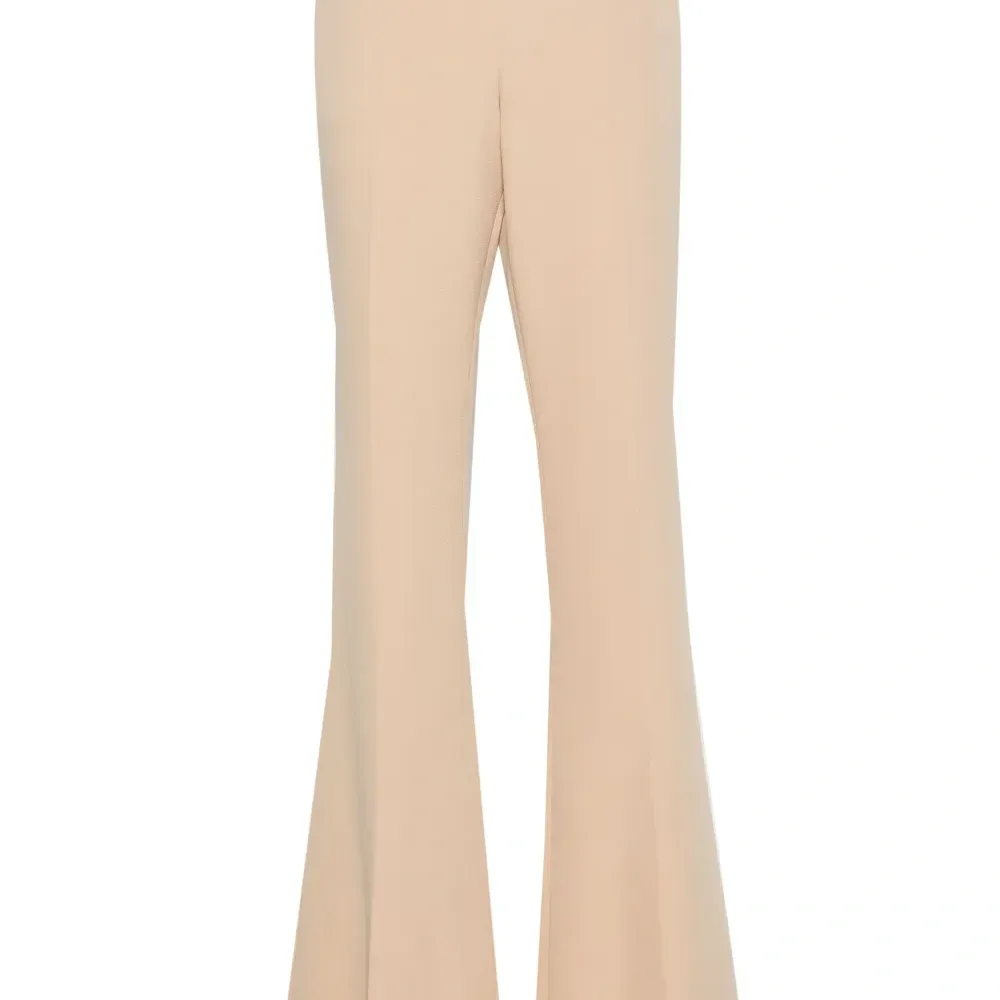 Расклешенные брюки со складками