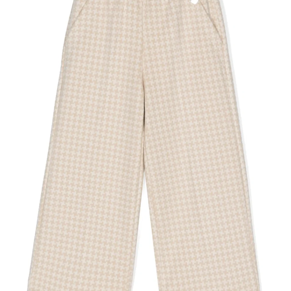 Широкие брюки в ломаную клетку