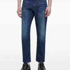 Джинсы из потертого денима