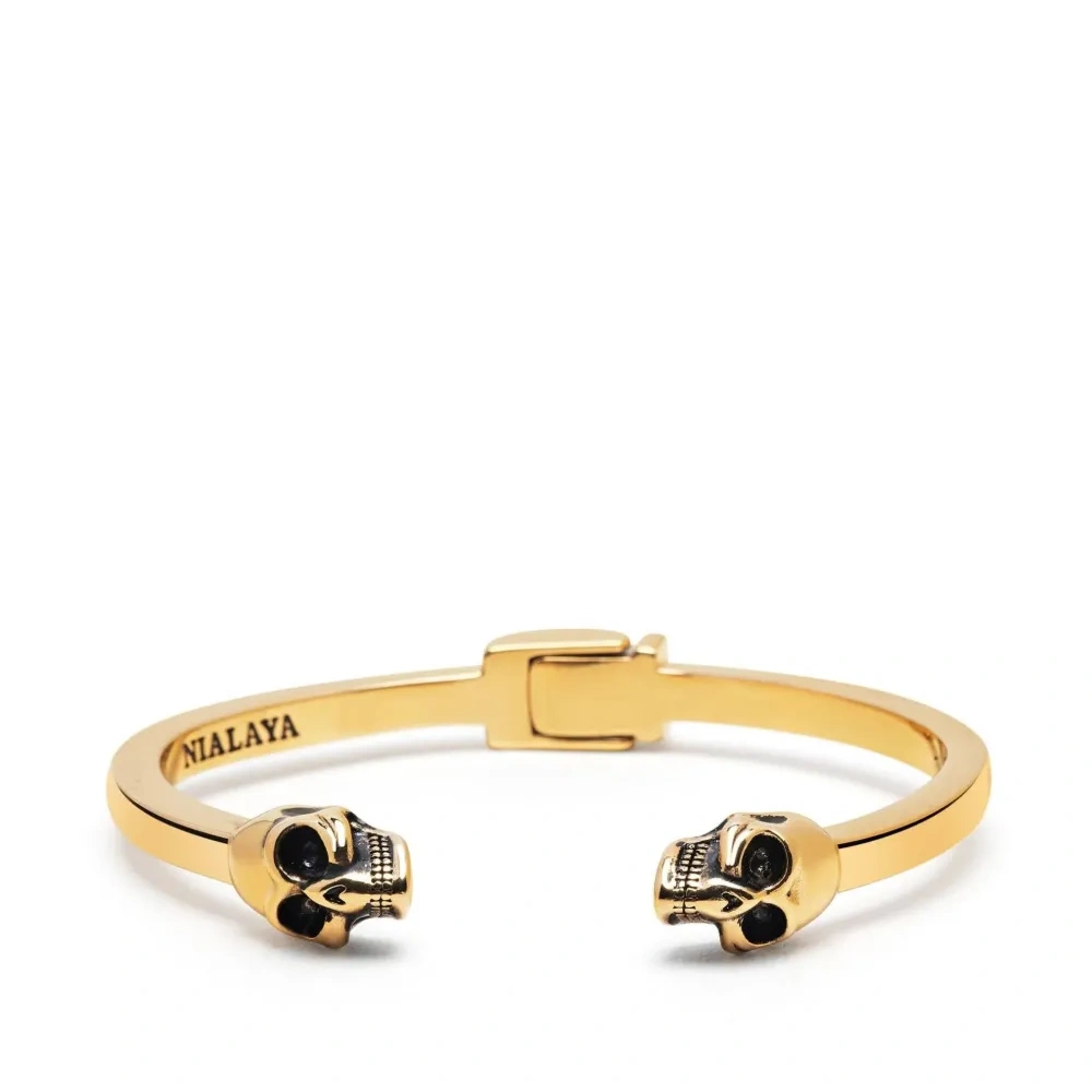 Позолоченный браслет с декором в виде черепов