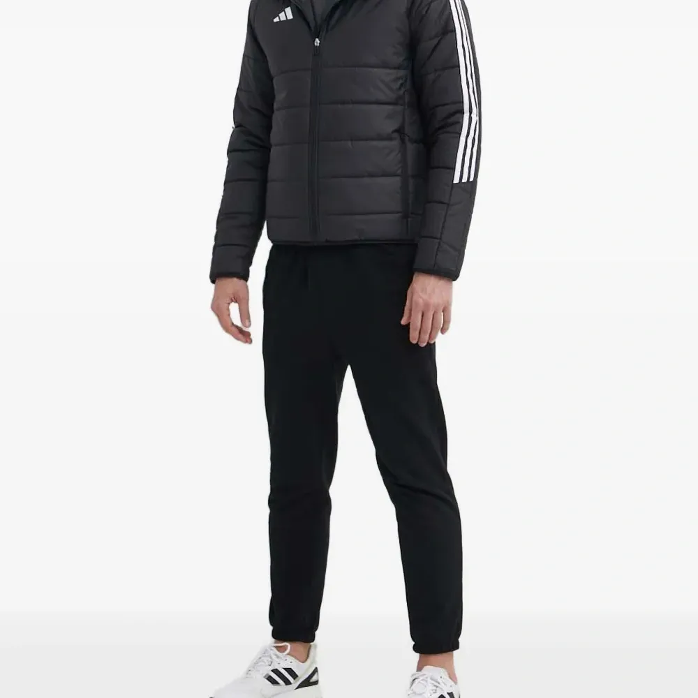 Стеганая куртка с тремя полосками Стеганая куртка с тремя полосками