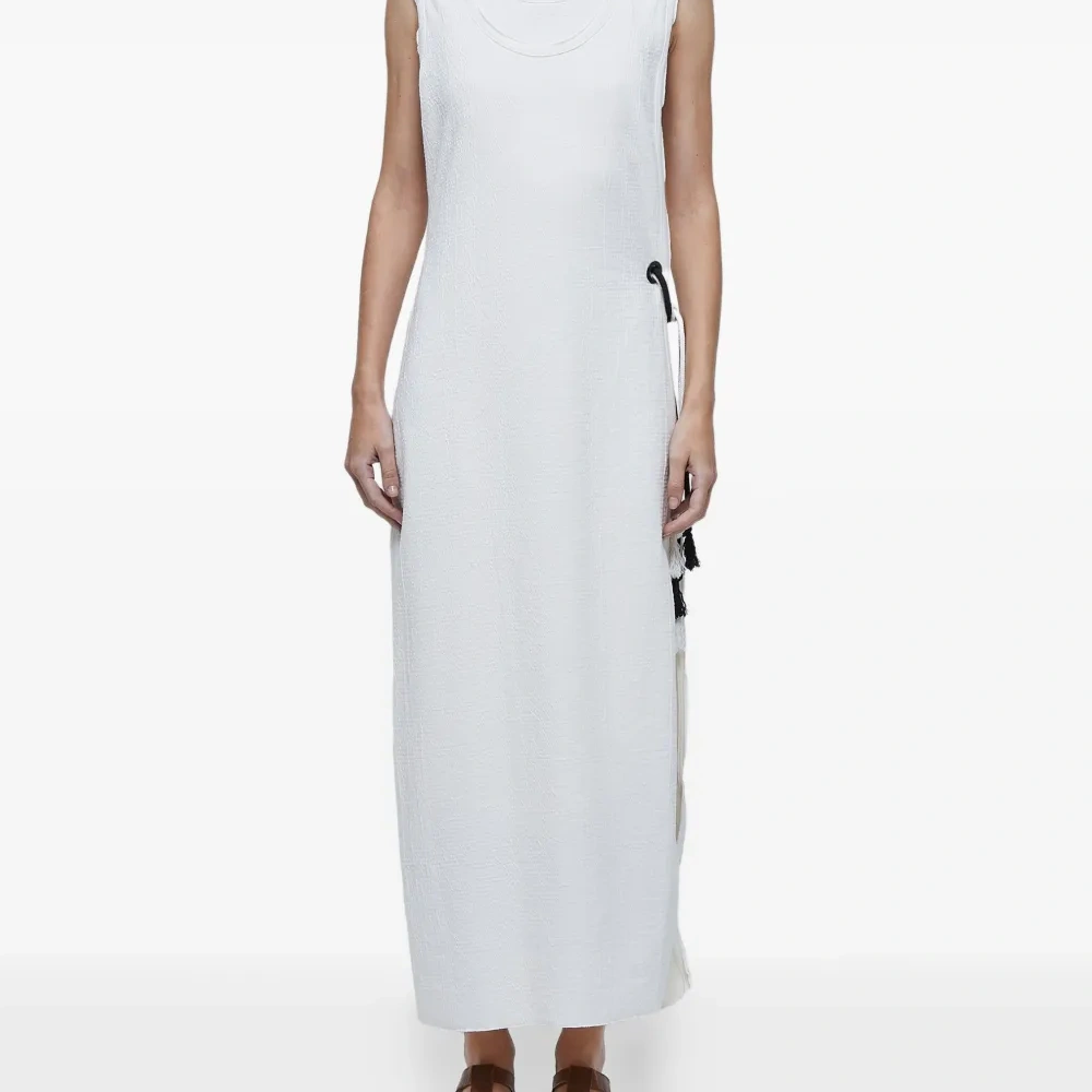 Двухслойное платье с кисточками