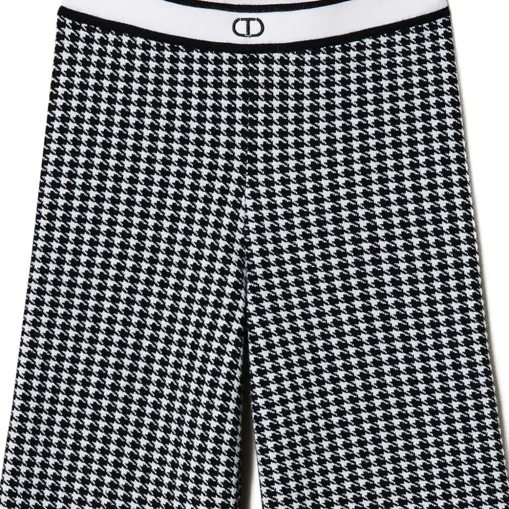 Жаккардовые брюки в ломаную клетку