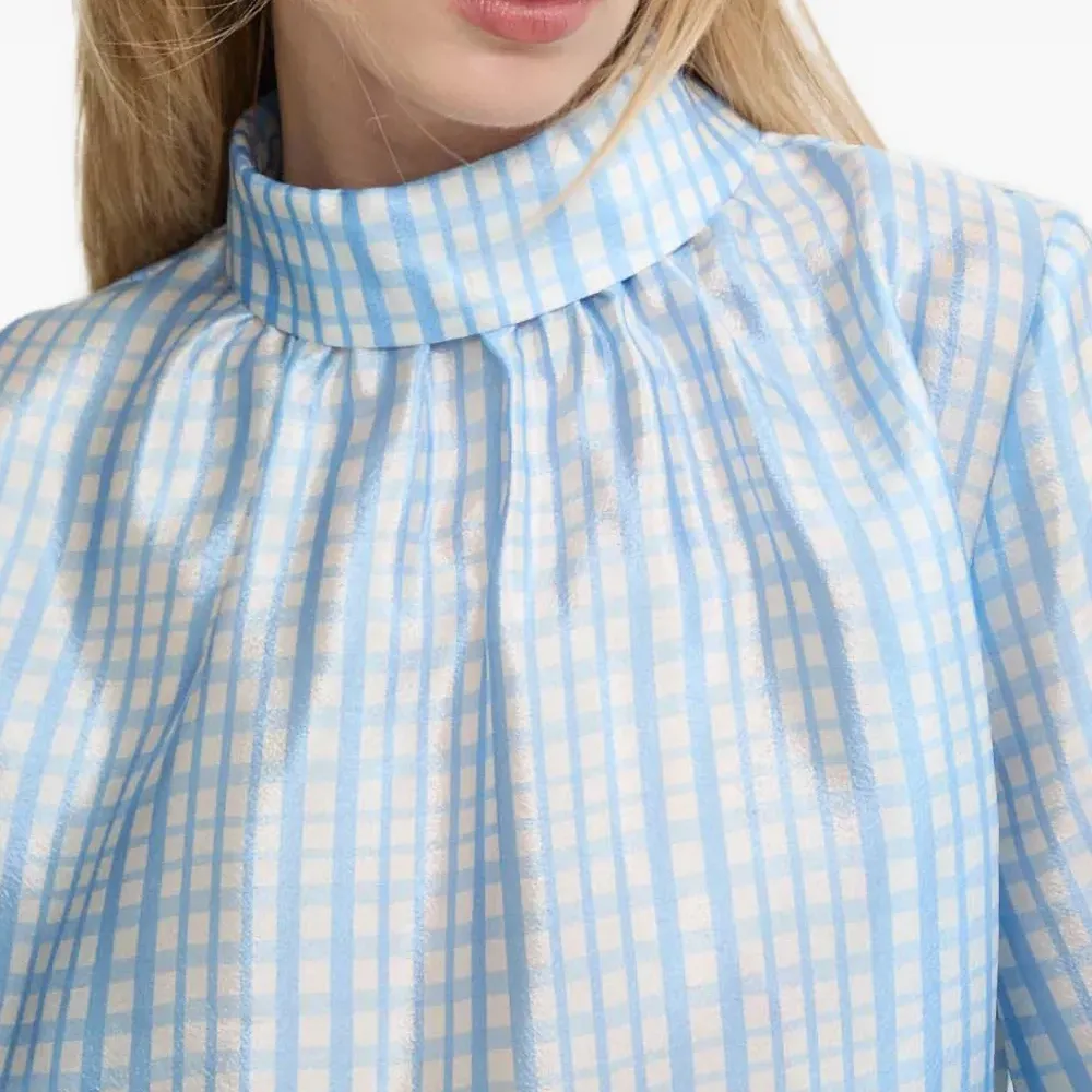 Блузка в клетку