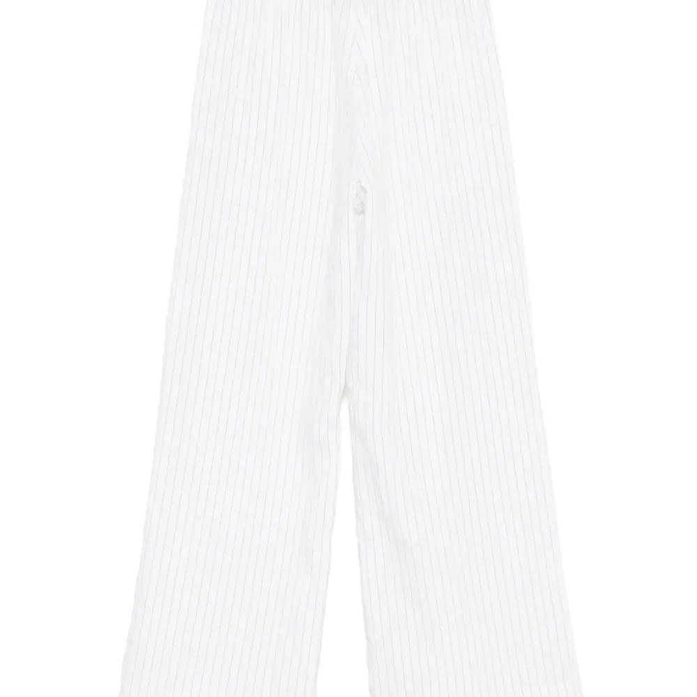 Брюки в тонкую полоску Брюки в тонкую полоску