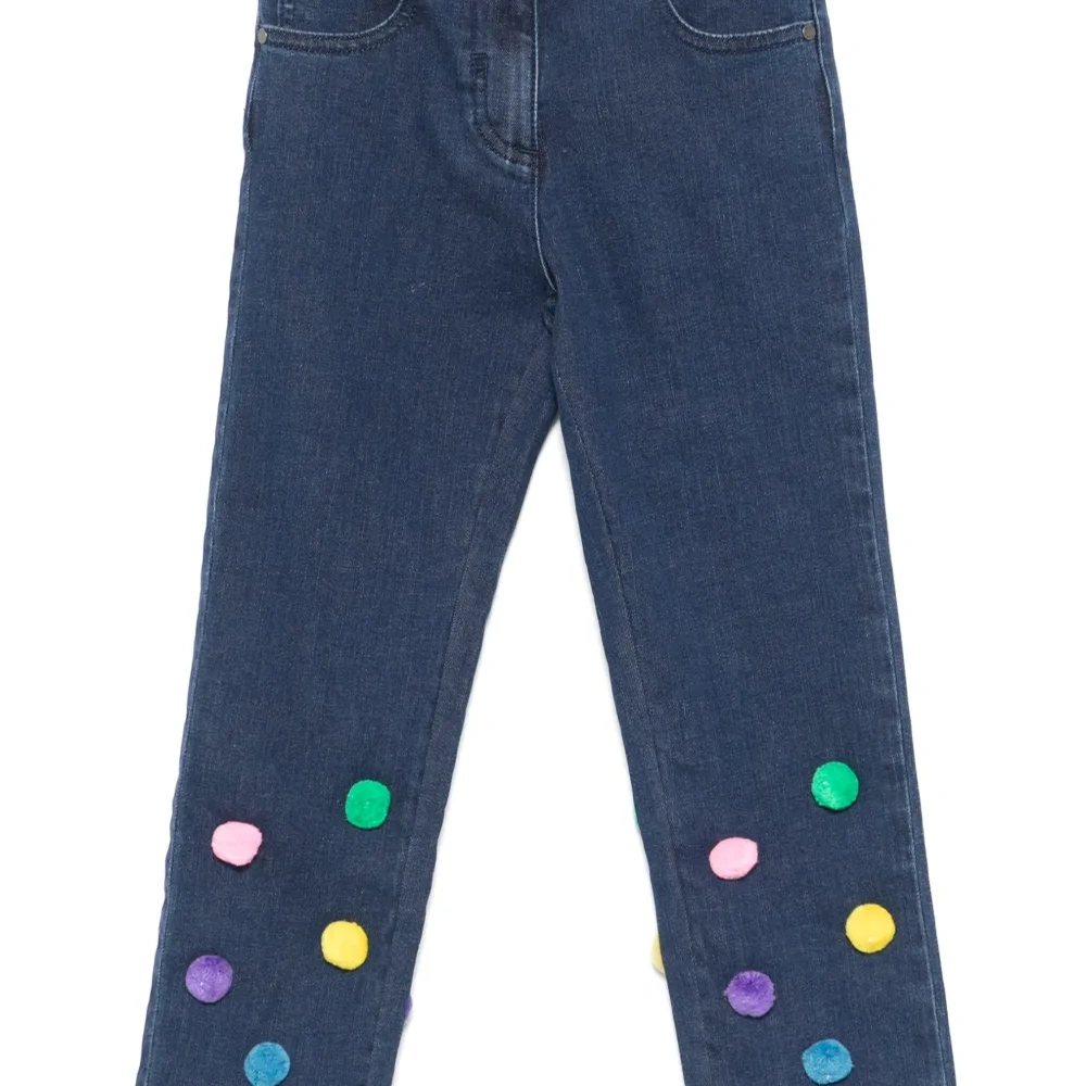 Джинсы с помпонами