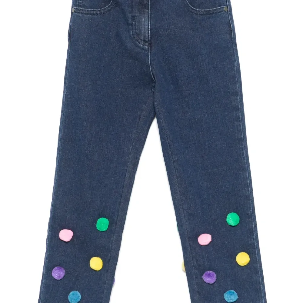 Джинсы с помпонами