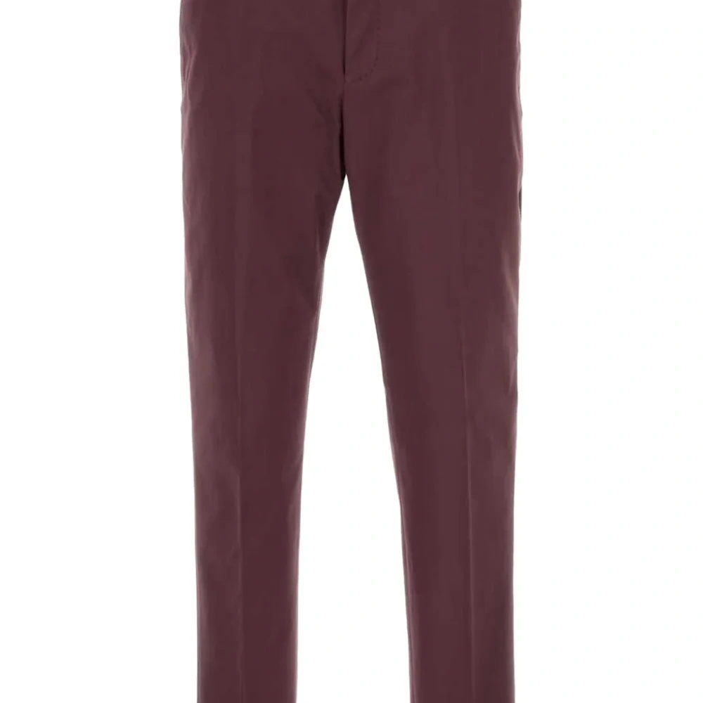 Зауженные брюки со складками