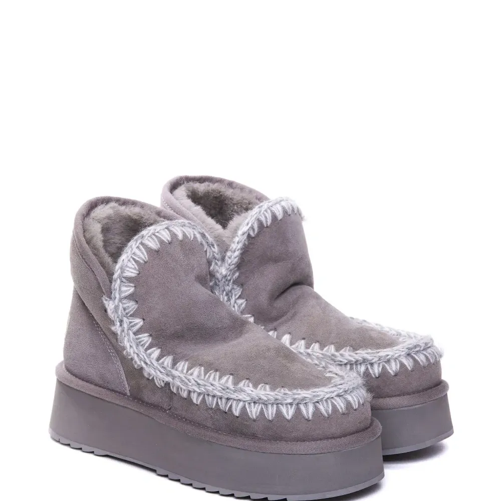 Ботинки с плетеной окантовкой