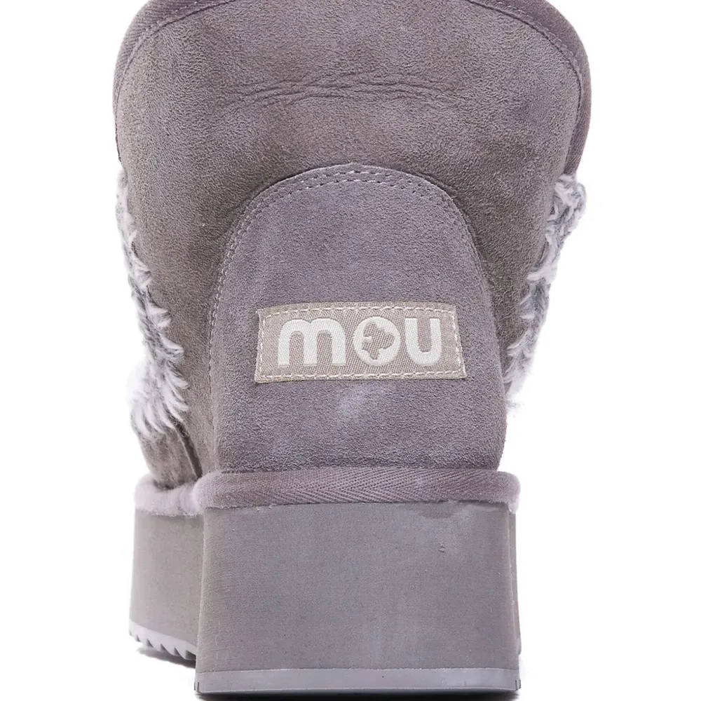 Ботинки с плетеной окантовкой