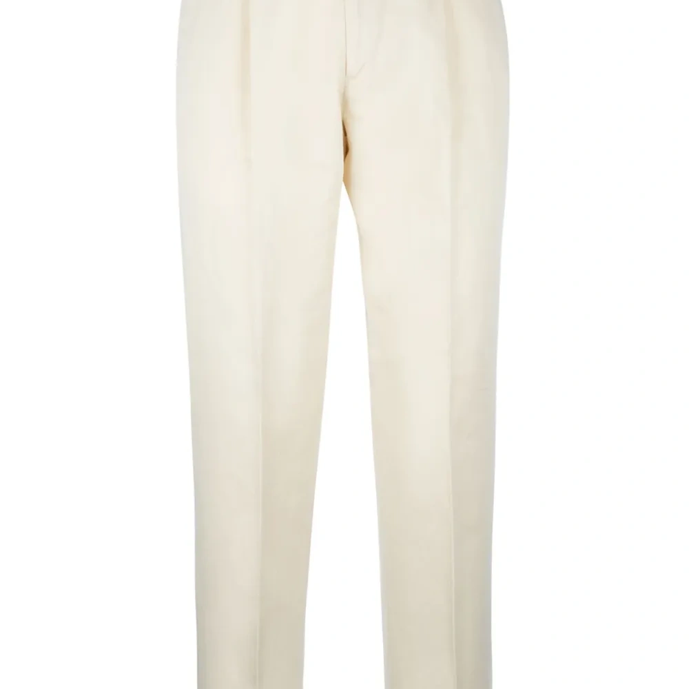 Зауженные брюки со складками