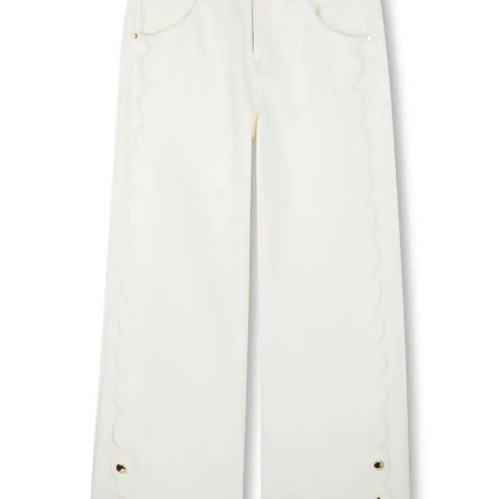 Джинсы с фестонами