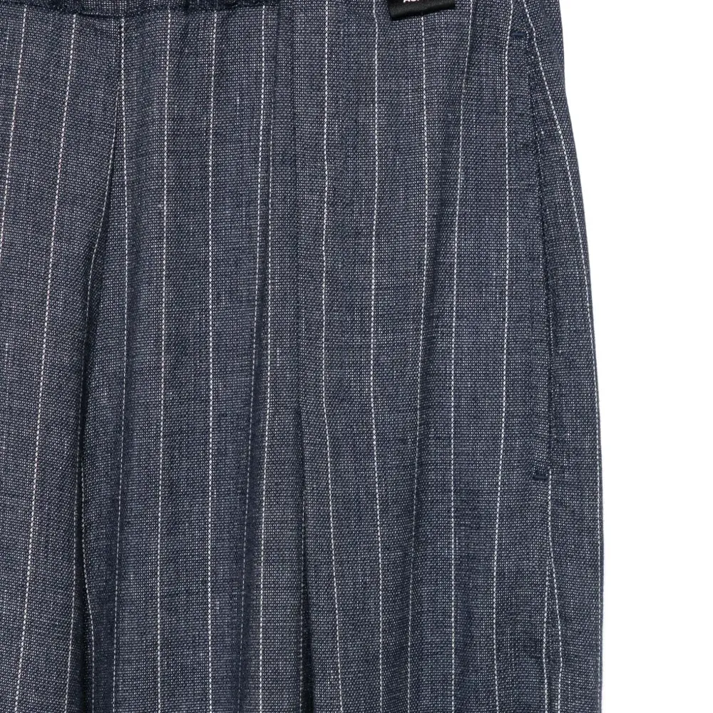 Брюки в тонкую полоску Брюки в тонкую полоску