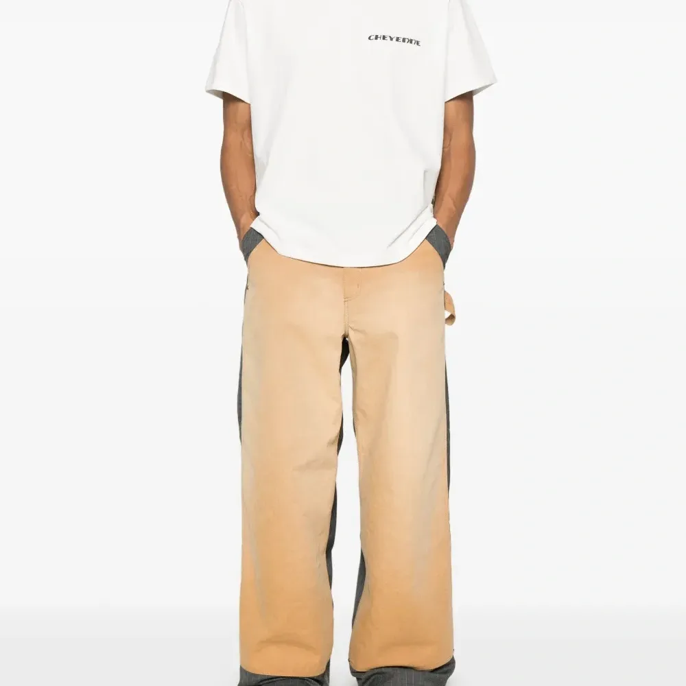 Брюки в тонкую полоску Брюки в тонкую полоску