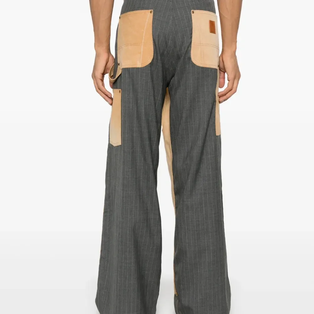 Брюки в тонкую полоску Брюки в тонкую полоску