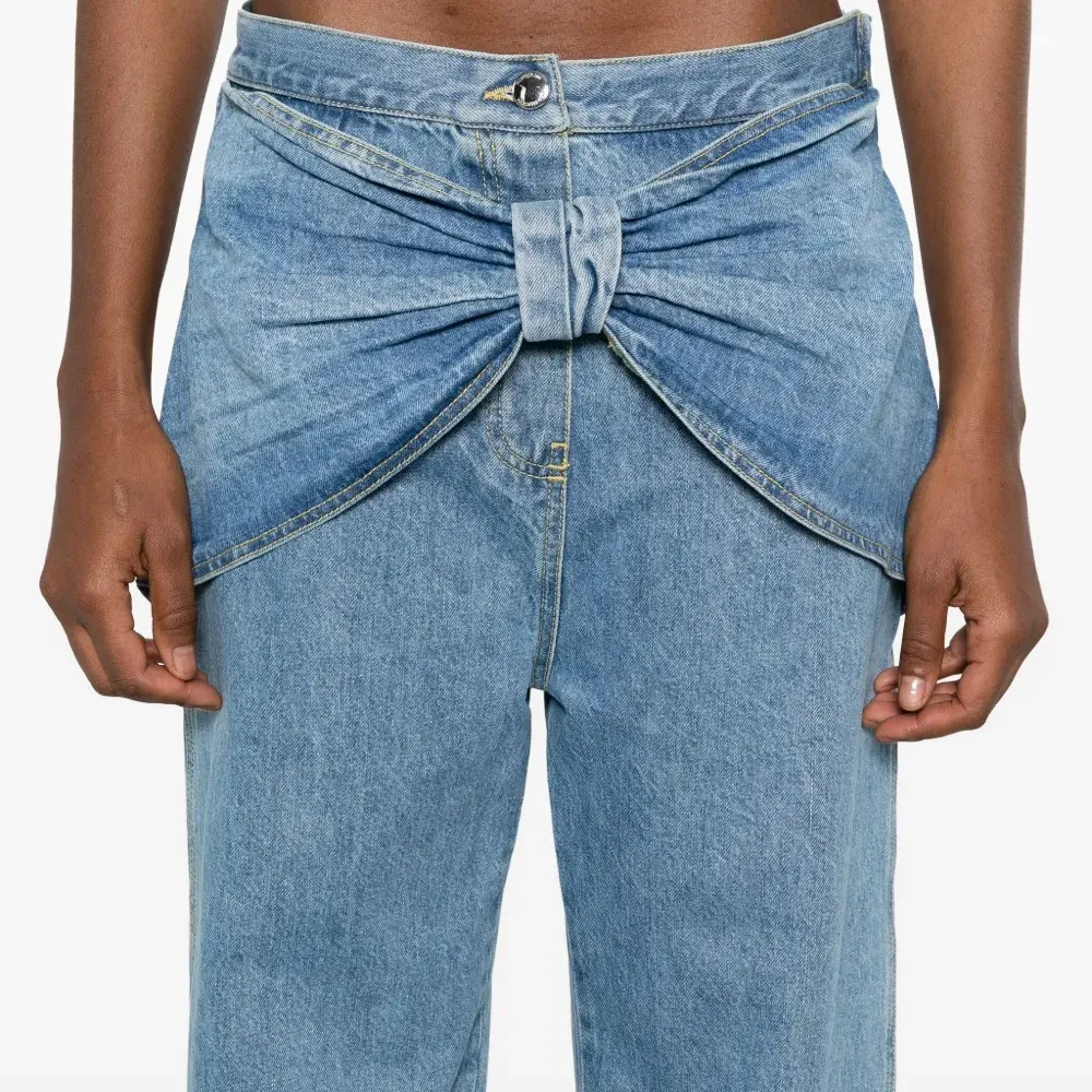 Джинсы с бантом