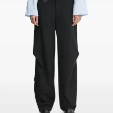 Брюки с карманами и драпировкой