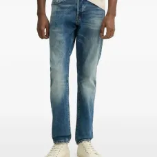 Джинсы с эффектом потертости Джинсы с эффектом потертости