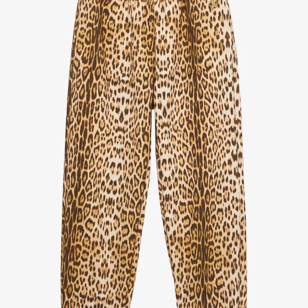 Брюки с леопардовым принтом Брюки с леопардовым принтом