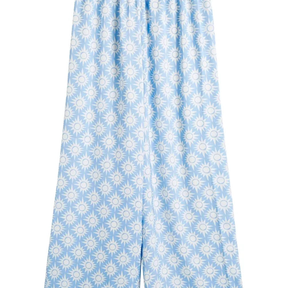 Брюки с принтом из коллаборации с Laura Whitmore