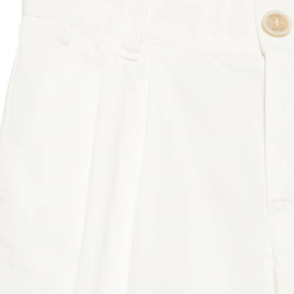 Зауженные брюки со складками