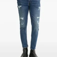 Зауженные джинсы с эффектом потертости