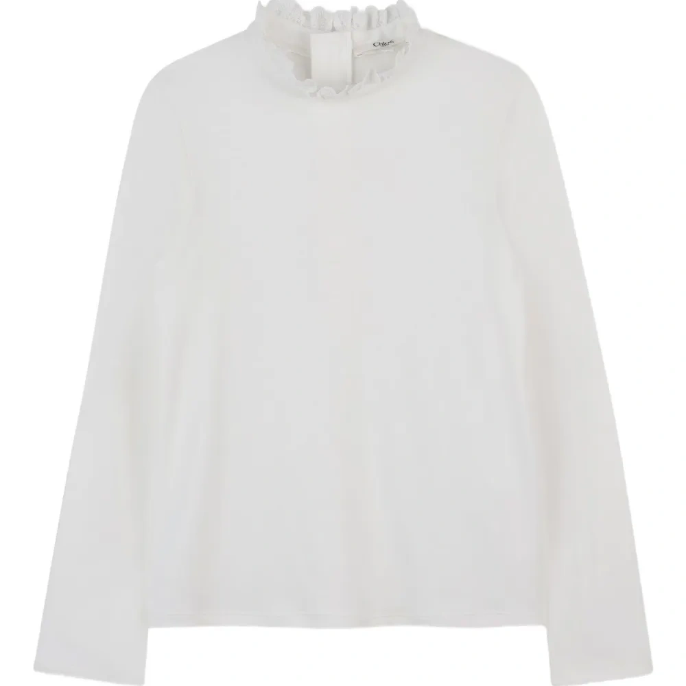 топ с высоким воротником и оборками