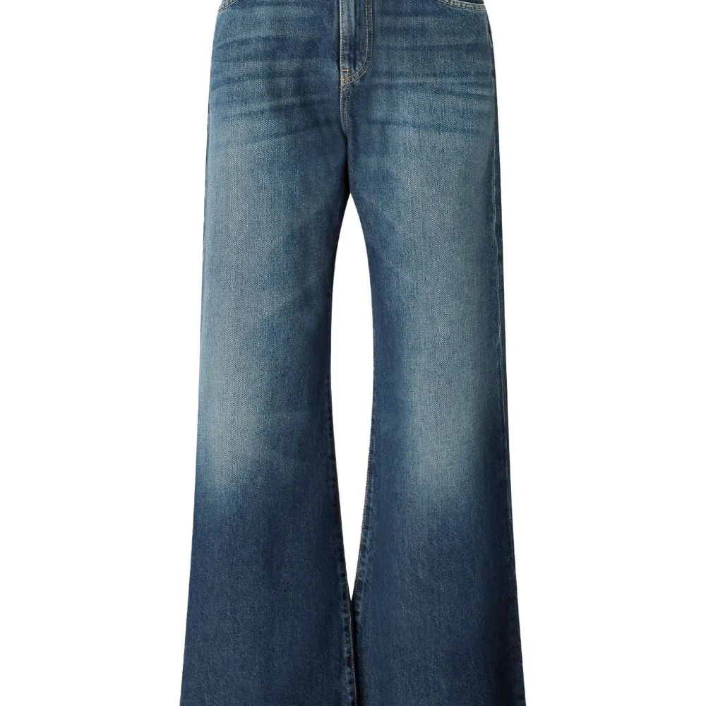 Джинсы с эффектом потертости Джинсы с эффектом потертости