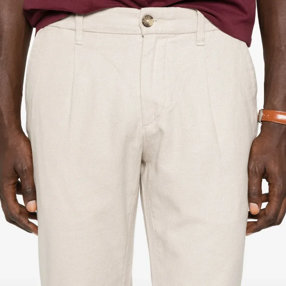 Брюки с защипами