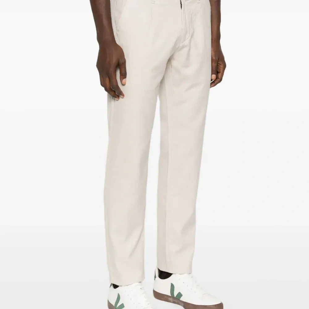 Брюки с защипами