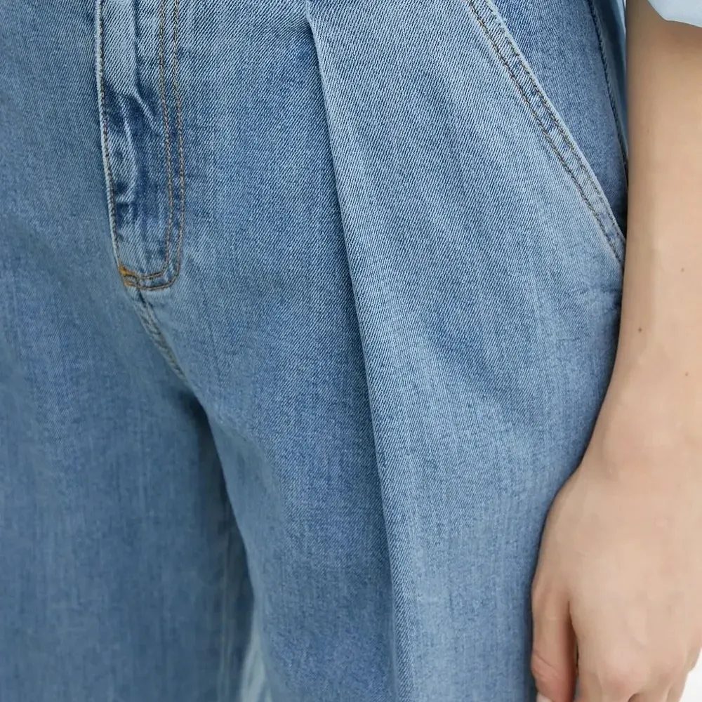 Джинсы со складками