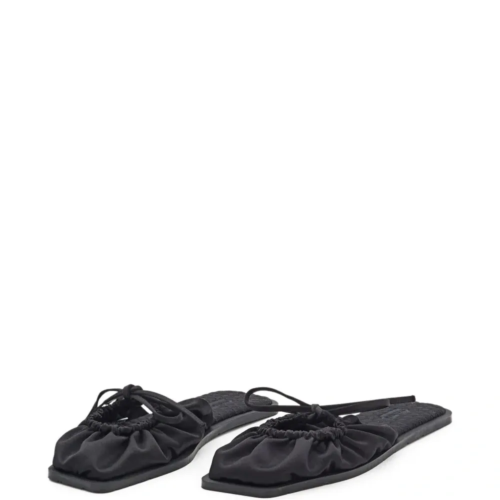 Мюли на плоской подошве с бантом